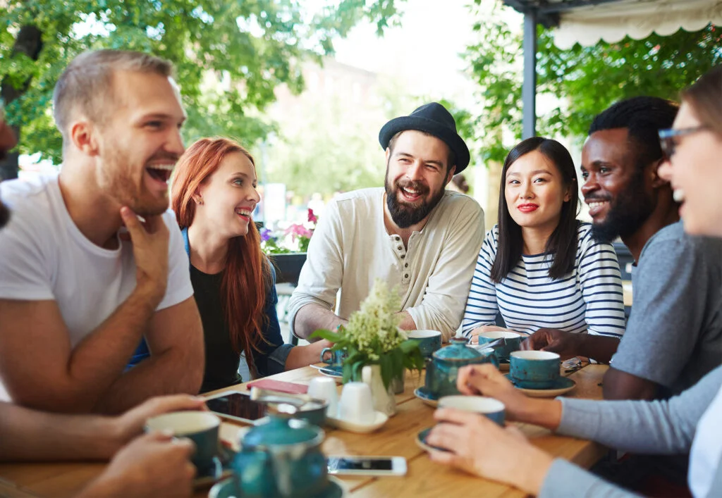 Friends talking around a table