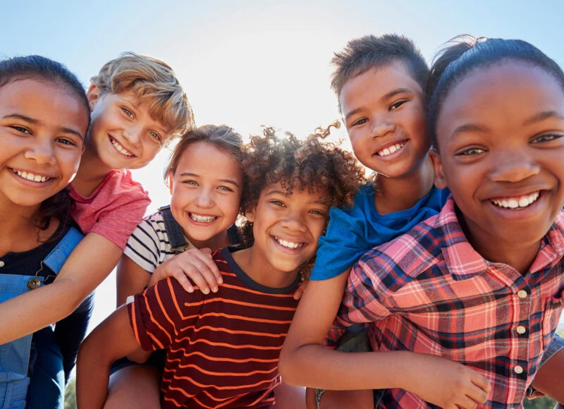 Smiling children posing together in kids ministry