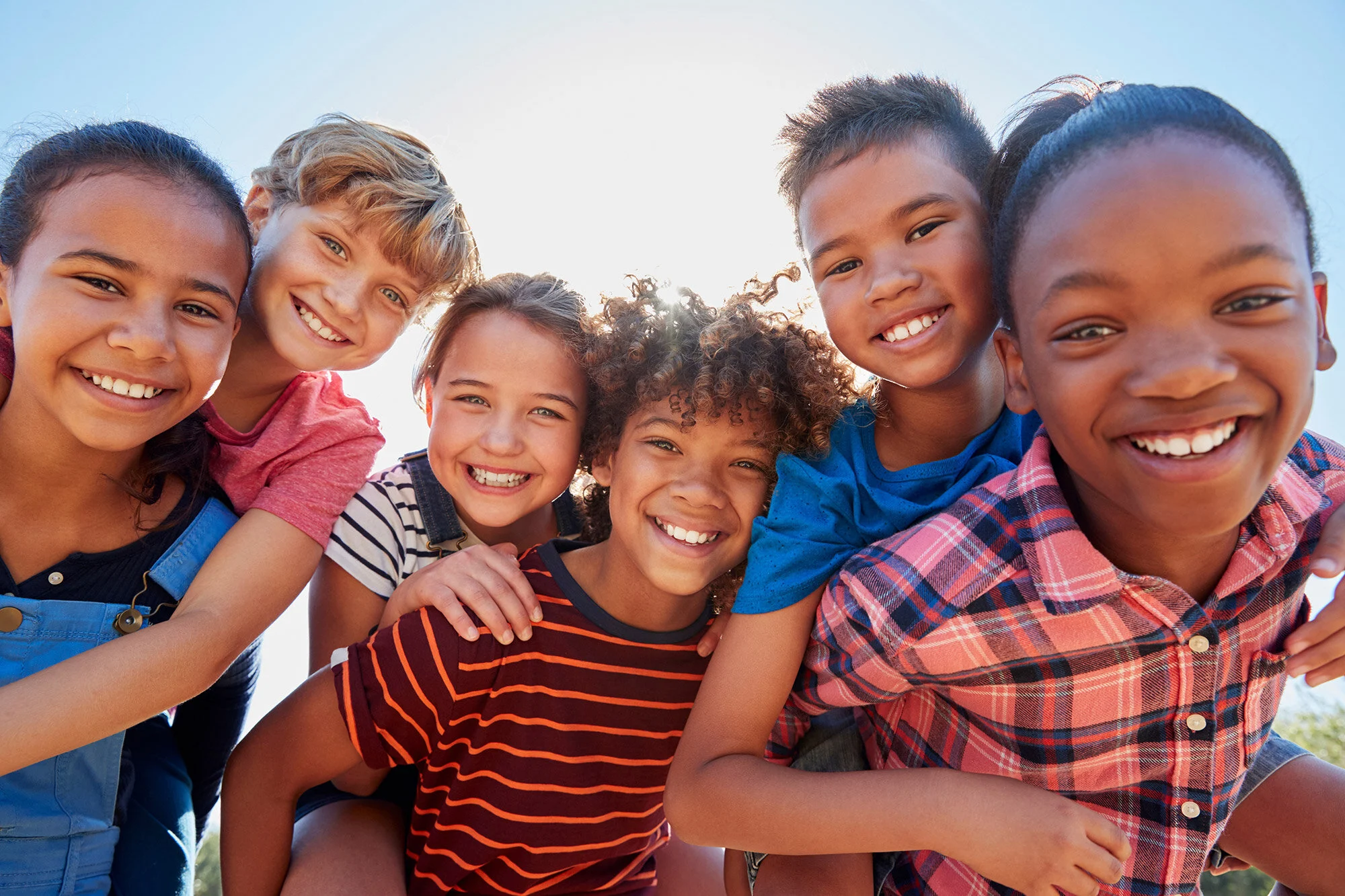 Smiling children posing together in kids ministry